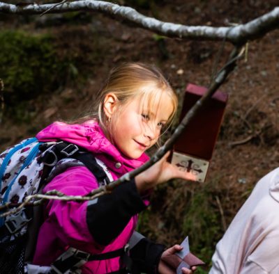 School girl with pilgrim waymarker