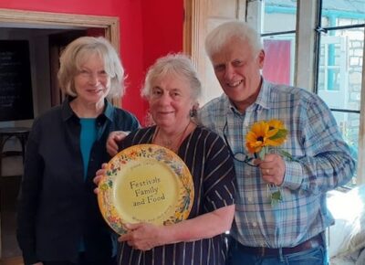 Martin, Diana and Judith holding commemorative plate