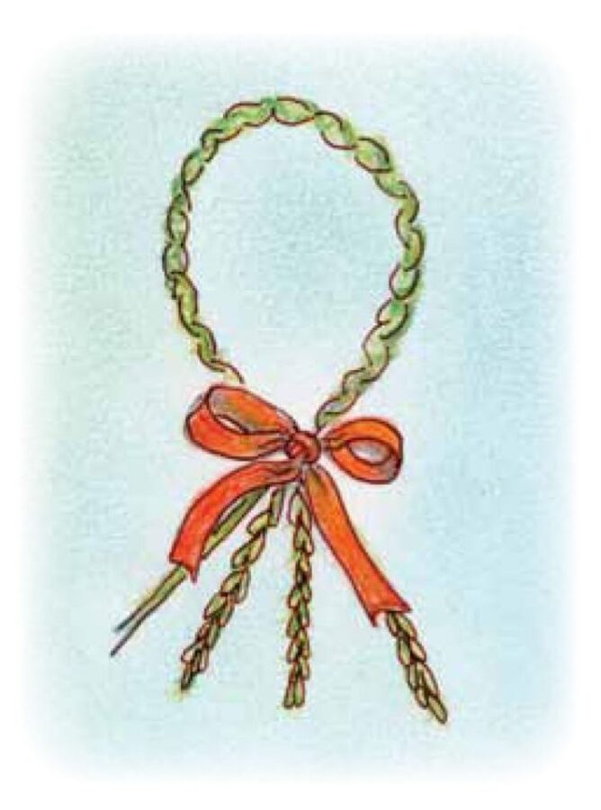 a dolly made from plaited grass