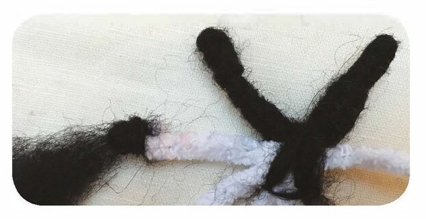 covering pipe cleaner 'spider legs' with wool