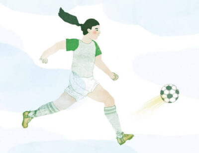 Girl playing football in the snow.